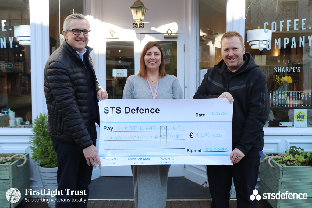 STS Defence staff presenting a cheque of £1,080.00 to First Light Trust Gosport Café Hub's National Activity Co-ordinator