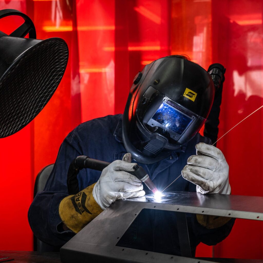 A cropped photo of an STS Defence welder.